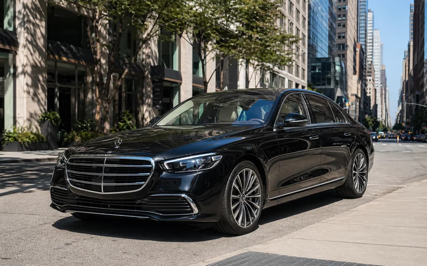 2025 Mercedes-Benz S-Class sedan at a sunny Manhattan curb
